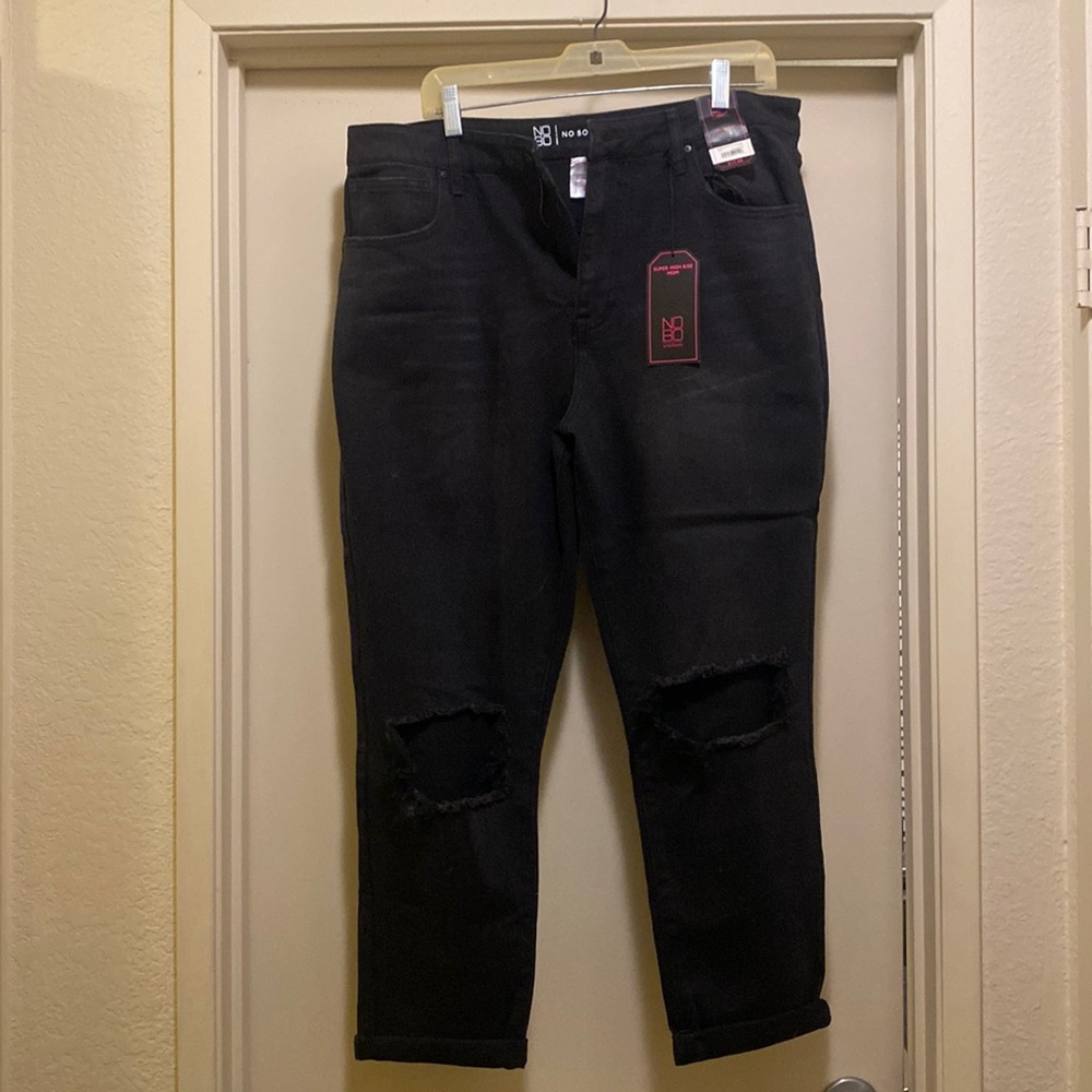 Brand new, tags attached. Size 17 high rise, rolled hems, distressed knees